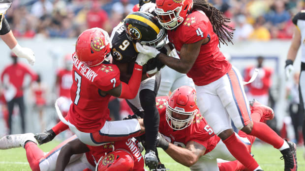 The Pittsburgh Maulers Madre Londown is brought down by New Jersey Generals Dravon Askew-Henry,left, and D JUam Hines in the second half Tom Benson Hall of Fame Stadium in Canton Ohio Saturday , June 17, 2023.  